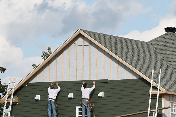 Professional Storm Damage Siding Repair technician working in Dorset, OH